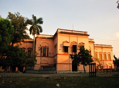 a two-story european mension in the sunset rays