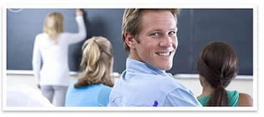 a smiling male student in a TEFL classroom